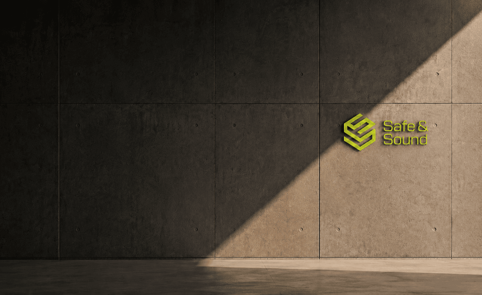 Sunlight across a concrete perimeter wall